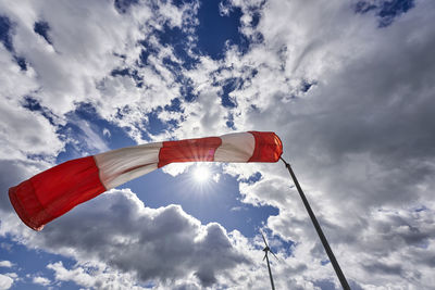 Low angle view of flag against sky