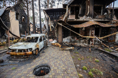 Cars burned down on the street. houses that burned down after being hit by rockets.