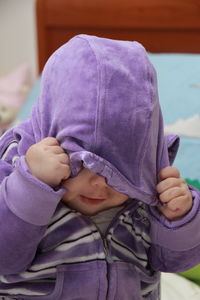 Full length of cute baby relaxing on bed