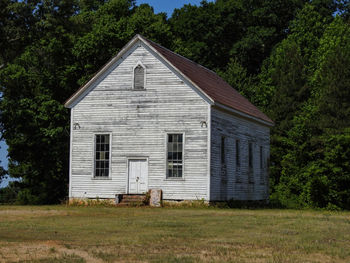 An old abandoned wooden one-room schoolhouse or church in a small rural community