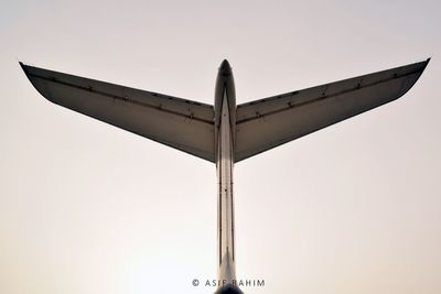 Low angle view of airplane against clear sky