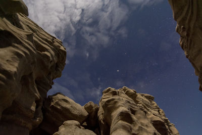 Low angle view of rock formation against sky