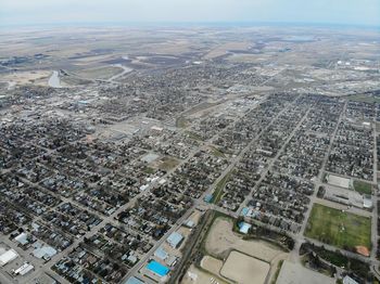 High angle view of buildings in city against sky