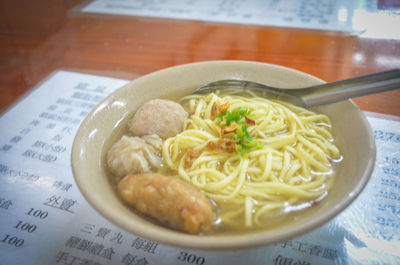 Close-up of soup with noodles in plate