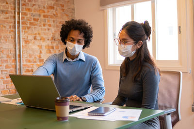 Business colleagues having discussion at office