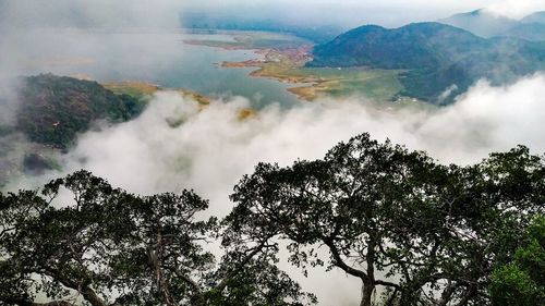 Scenic view of waterfall against sky