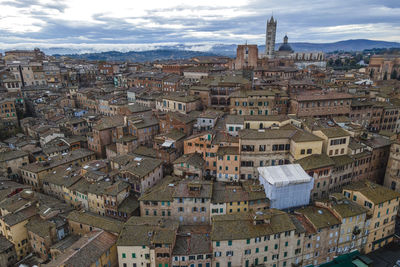 Aerial view of duomo di siena, the main cathedral in town with a residential district