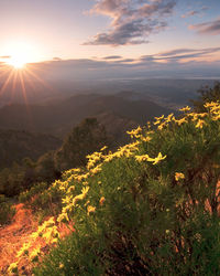 Scenic view of mountains against sky during sunset