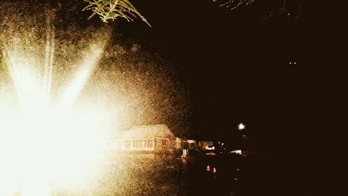 Illuminated fountain at night