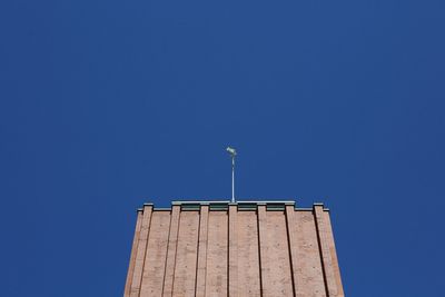 Low angle view of building against blue sky