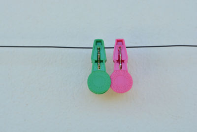 Close-up of multi colored clothespins on clothesline