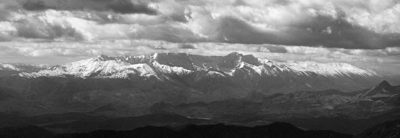 Scenic view of snowcapped mountains against sky