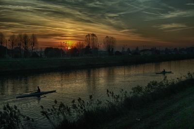 Scenic view of lake against sky during sunset