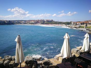 Panoramic view of sea and buildings against sky