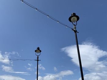 Low angle view of street light against sky