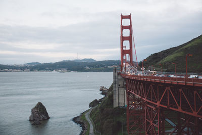 Traffic on golden gate bridge over san francisco bay against sky