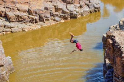 A diver at chebloch gorge in kerio river, baringo county, kenya