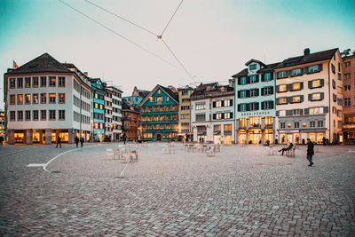 Buildings in city against sky