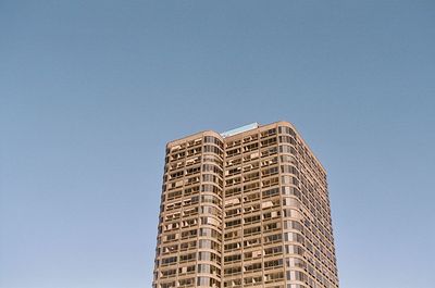 Low angle view of modern building against clear sky