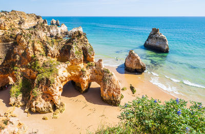 Praia dos três irmãos, one of the most beautiful beaches in the area of portimão, algarve, portugal