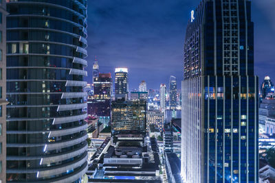 Modern buildings in city at night