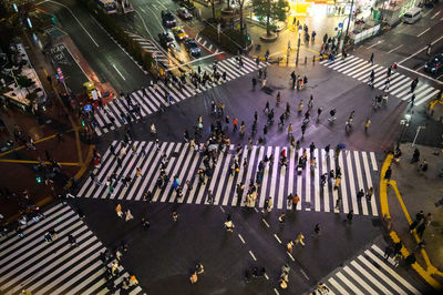 High angle view of people crossing road