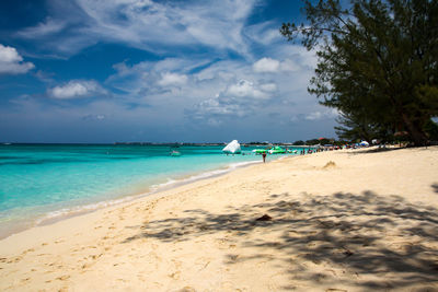 Scenic view of beach against sky in georgetown, grand caymans 