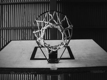 Close-up of basketball hoop against wall