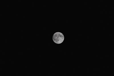 Low angle view of moon against clear sky at night