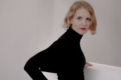 Portrait of a young woman over white background