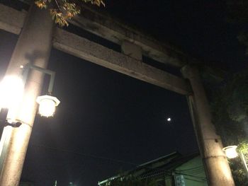 Low angle view of illuminated built structure at night