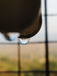 Close-up of water drops on rusty metal