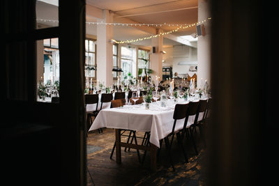 Empty chairs and tables in restaurant