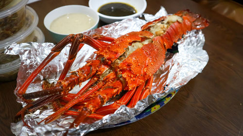 High angle view of lobster in plate on table