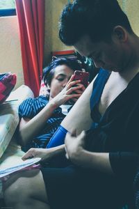 Young couple looking at camera