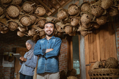 Portrait of young man standing in store