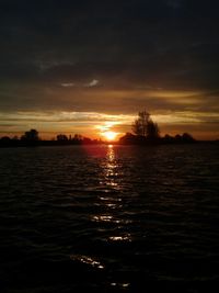 Scenic view of sunset over river