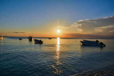 Scenic view of sea at sunset