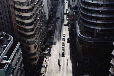 High angle view of city street by modern buildings