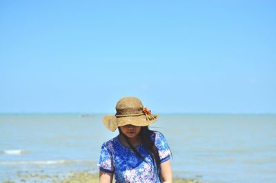 Woman standing on beach