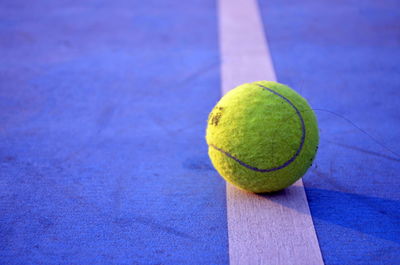 High angle view of green ball on blue background