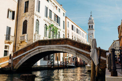 Arch bridge over canal in city