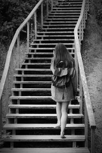 Woman climbing on steps