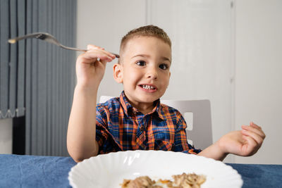 Close-up of boy eating food