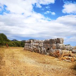 Old ruin building against cloudy sky
