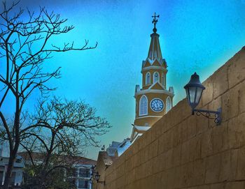 Low angle view of building against blue sky