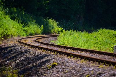 Curved railroad track in the countryside