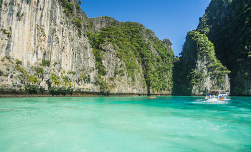 Scenic view of sea against clear blue sky