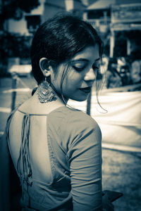 Portrait of a young woman looking away