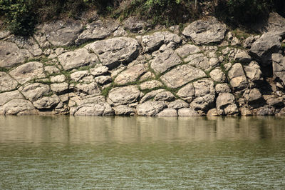 Reflection of rocks in river